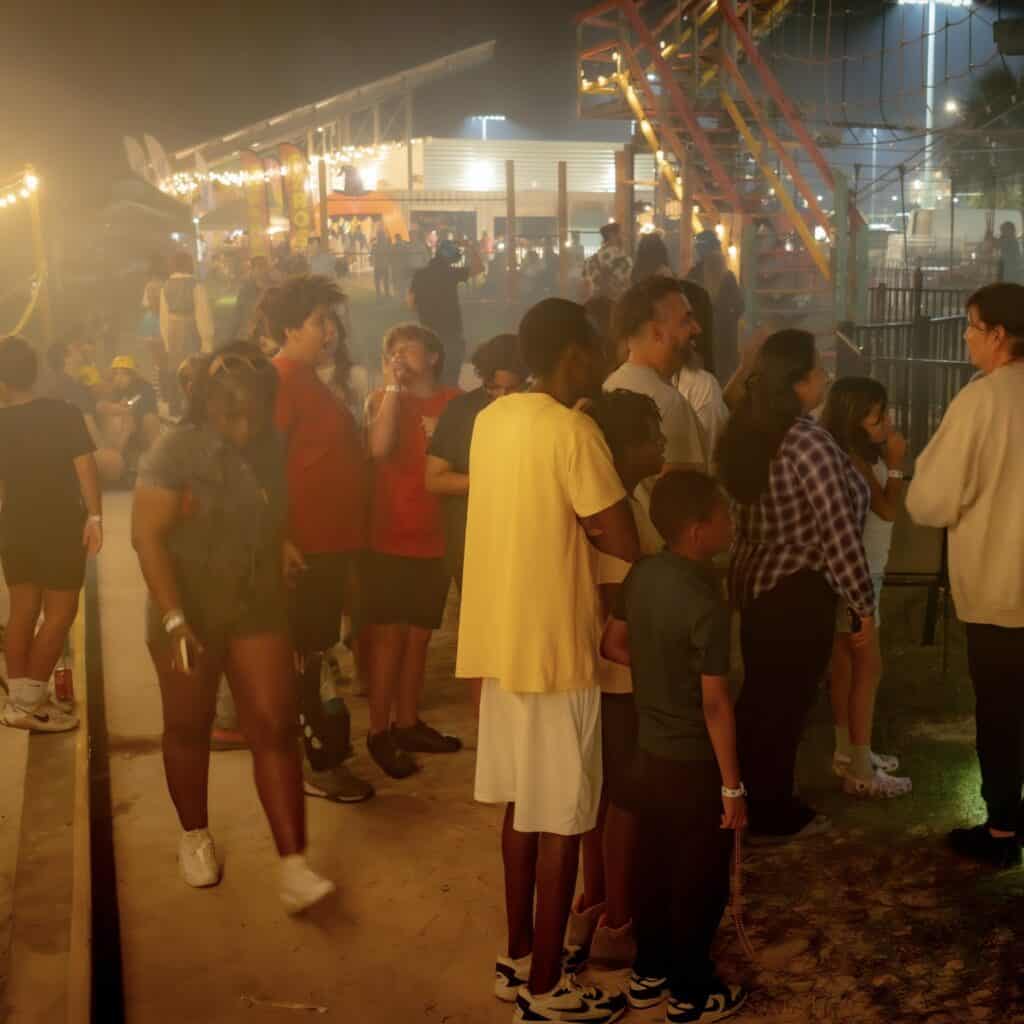 Families walking through a monster maze at Boo Orlando at Nona Adventure Park