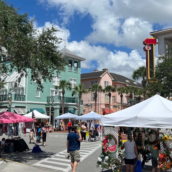 Shoppers browsing vendor tents at Celebration Farmers Market