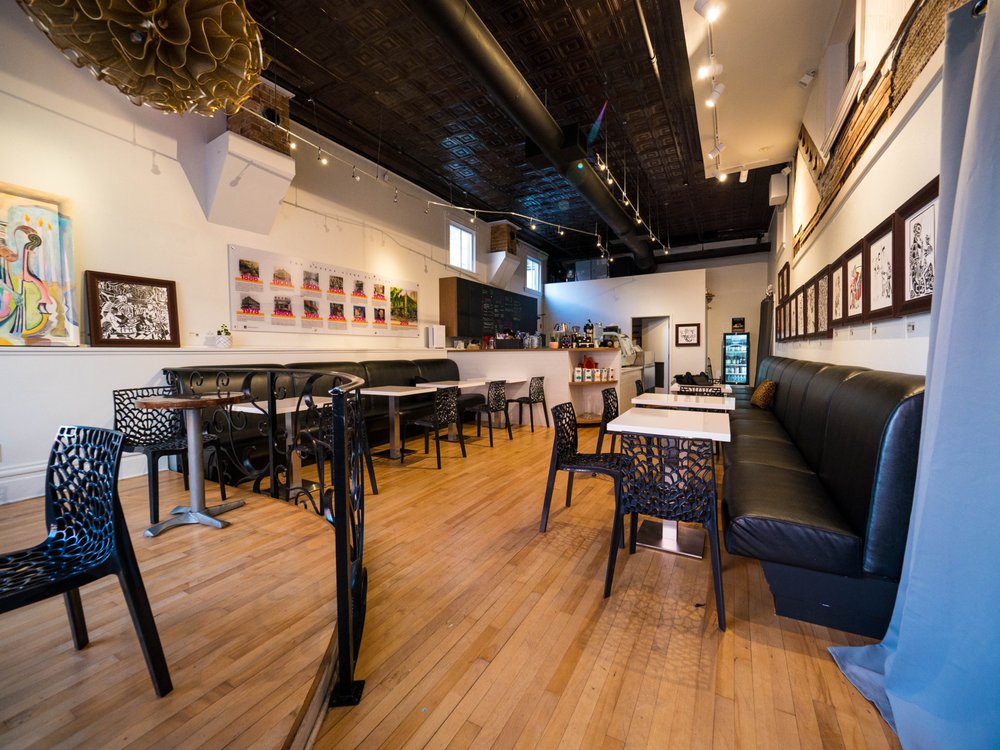 A trivia crowd at tables inside Dr. Drips Coffee during an afternoon event