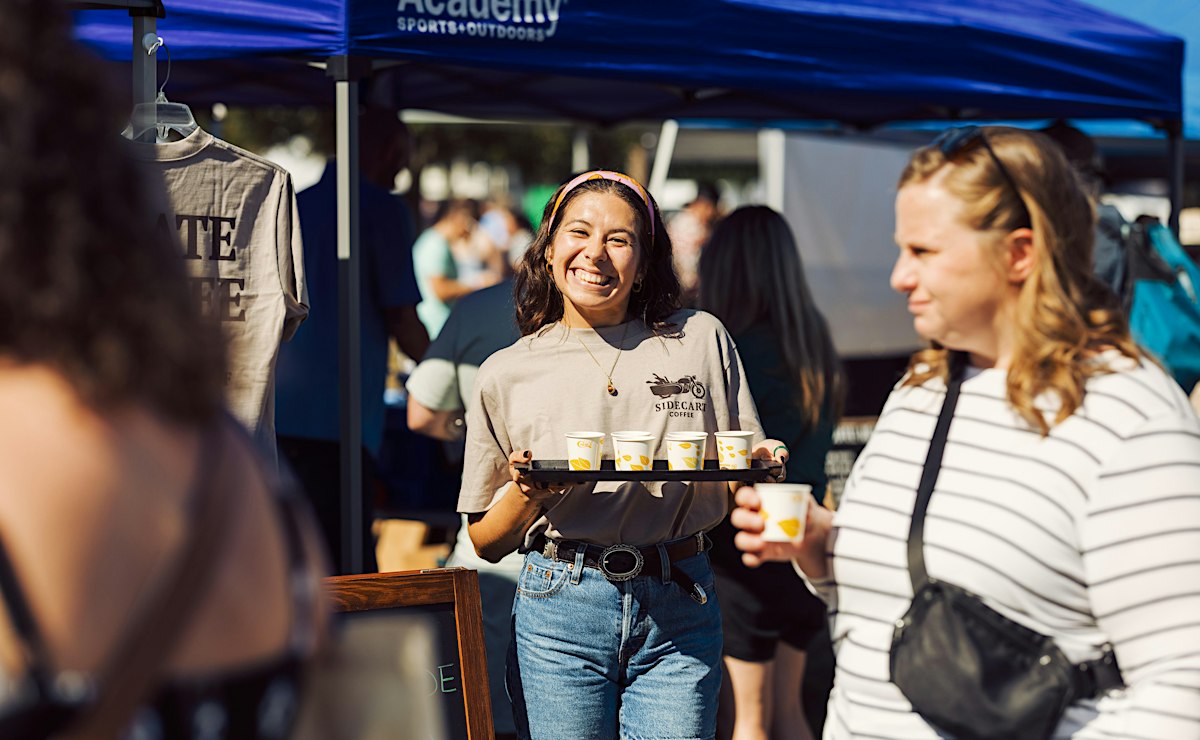 Crowds tasting coffee at roaster booths during the Florida Coffee Festival at Festival Park