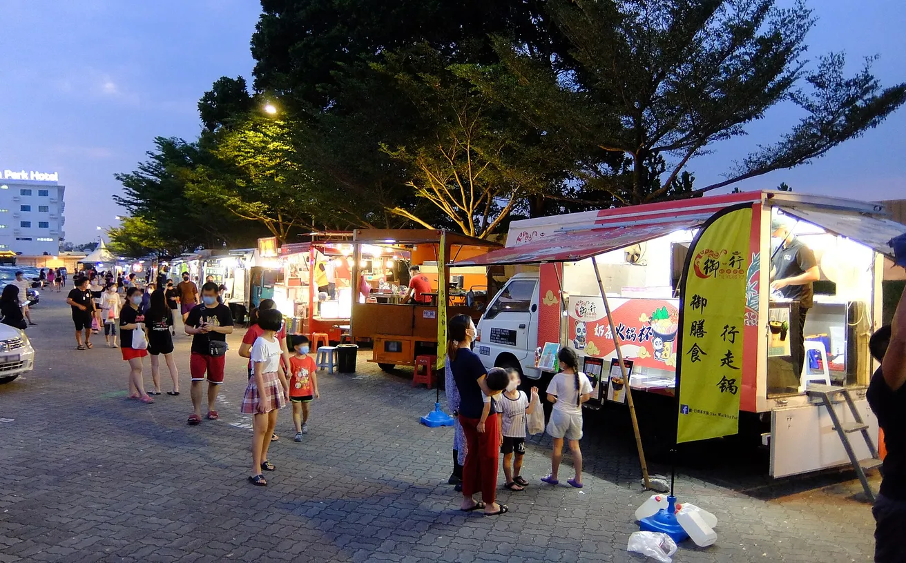 Evening crowds browsing Korean food stalls at the Seoul Dalbam Night Market in Avalon Park