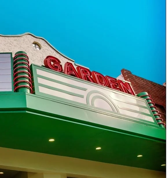 The marquee of the Garden Theatre on Plant Street lit up at night in Winter Garden
