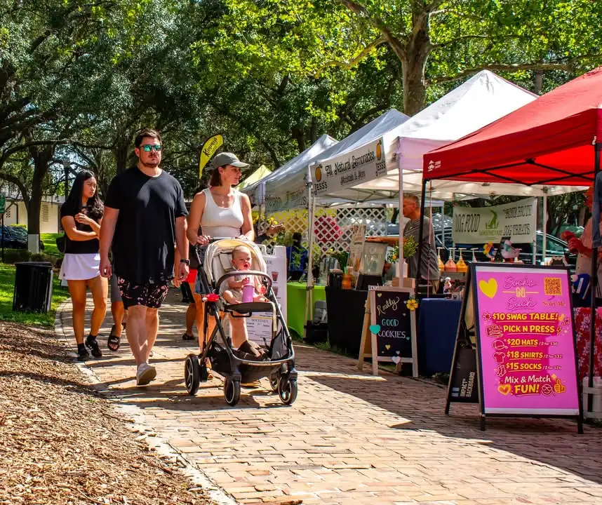 Shoppers browsing vendor tents at Maitland Farmers Market