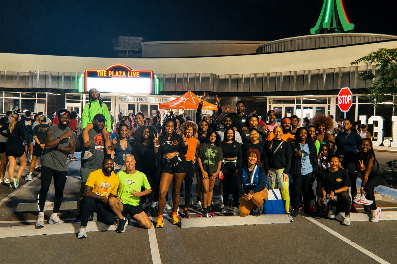 Runners gathered at night outside The Plaza Live for the half marathon weekend shakeout run