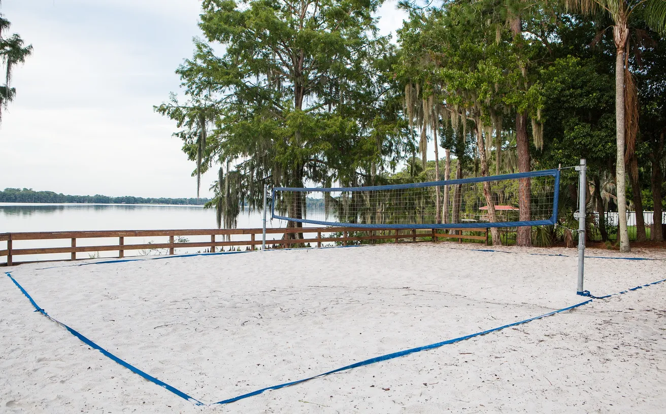 A Friday night sand volleyball league game under the lights at Festival Park