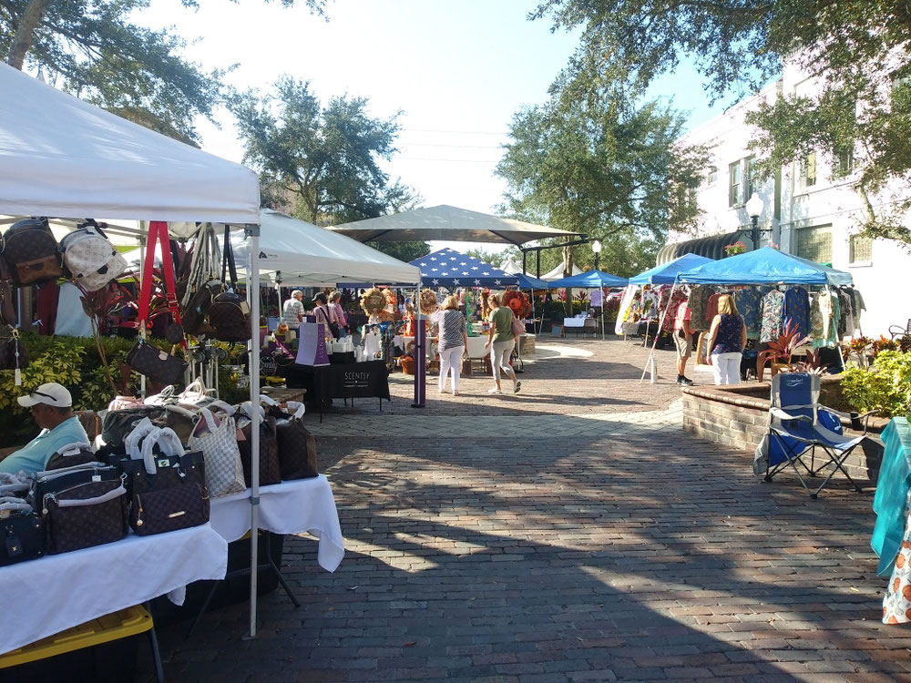 Shoppers browsing vendor tents at Sanford Marketplace at Magnolia