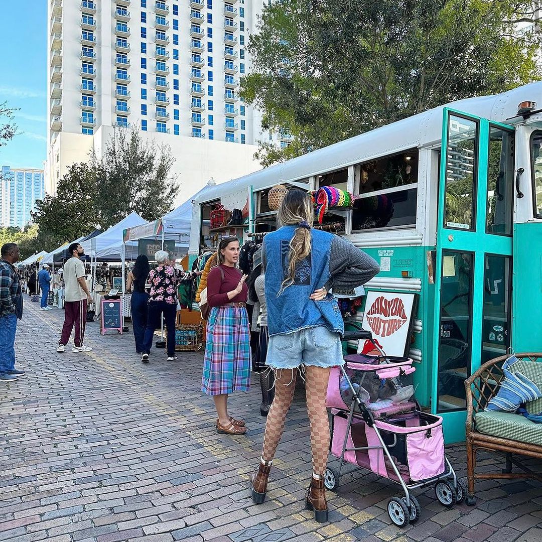 Shoppers browsing vendor tents at TPD Night Market (Thornton Park)