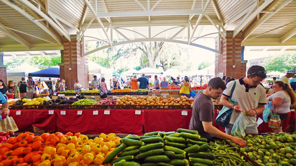 Shoppers browsing vendor tents at Winter Garden Farmers Market